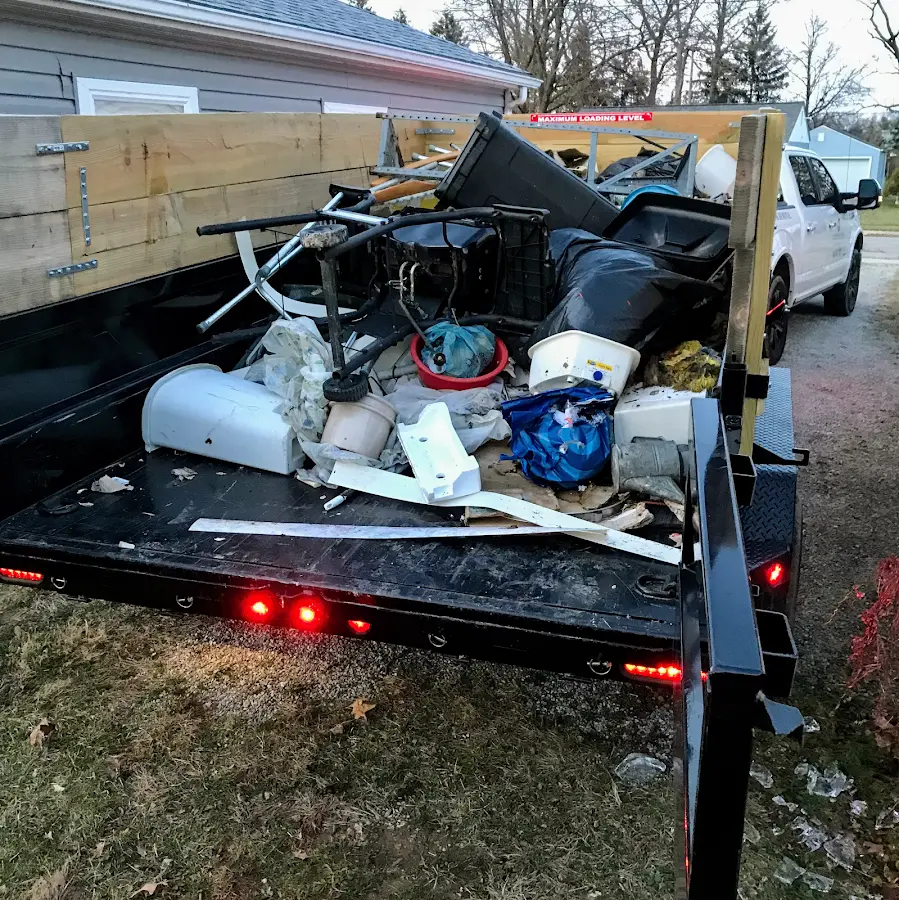 Roll-off dumpster delivered to a residential driveway in Attica