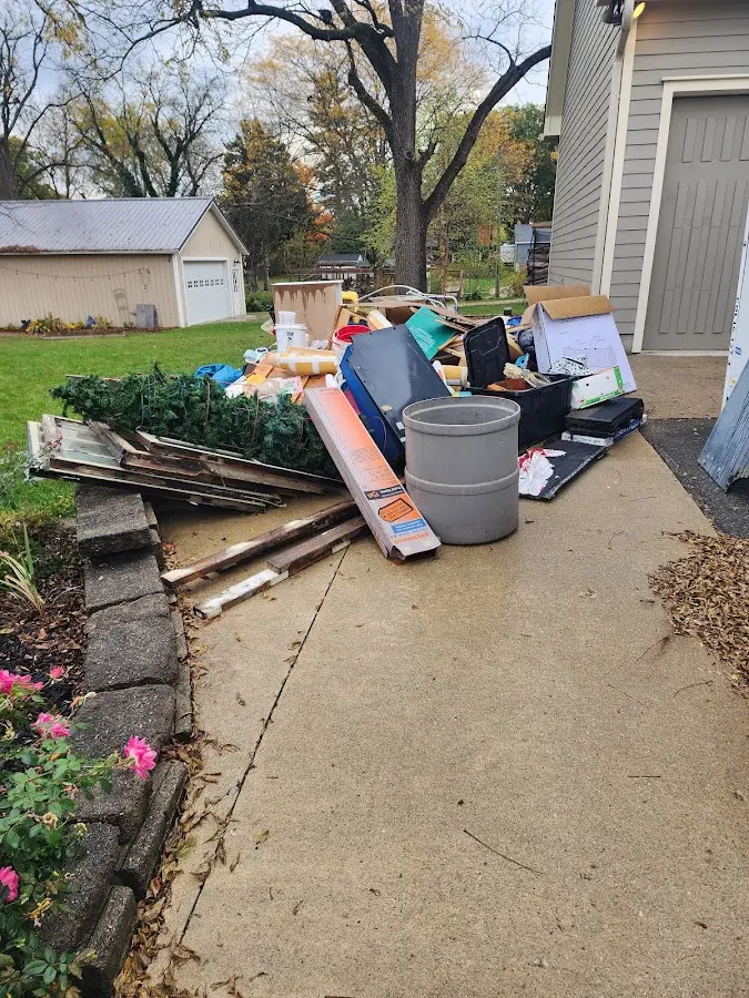 Dumpster being loaded with debris for Estate Cleanout Dumpster Rental in Attica